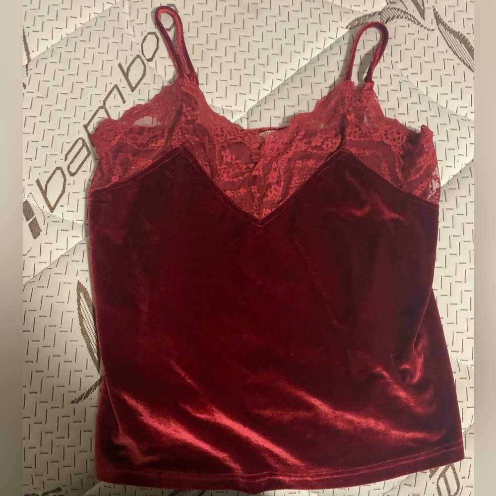 A red shirt with lace on the top